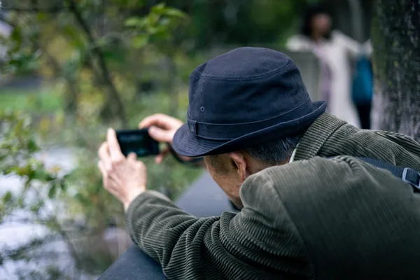 Man Photographing Park 1