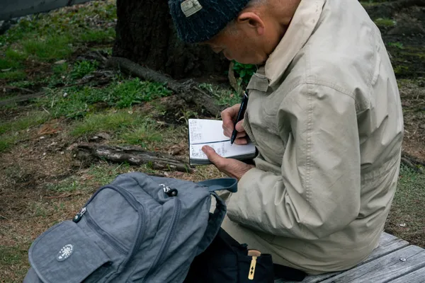 Man Sketching Bench 1